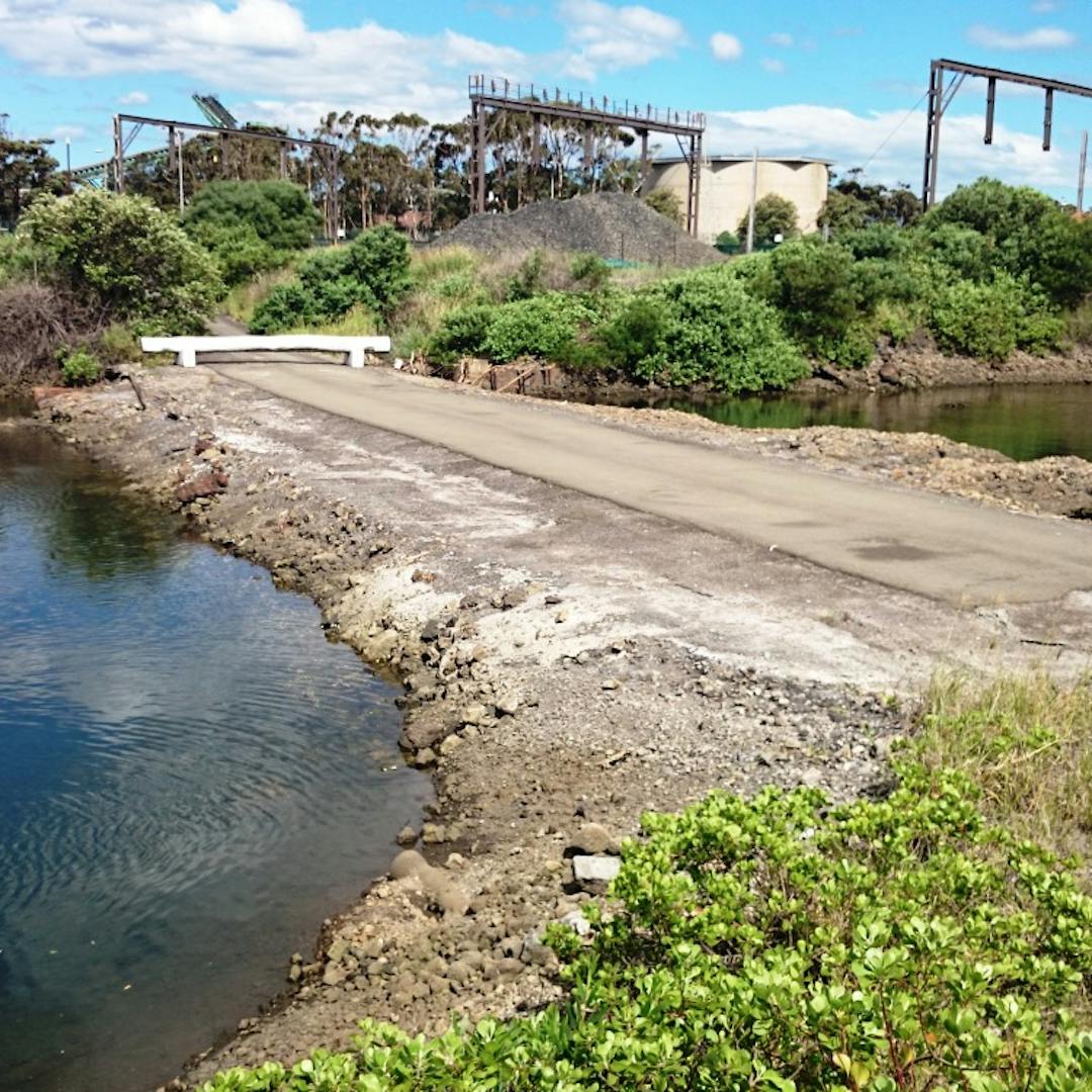 A picture of the concrete road causeway across Guranguty waterway, Wollongong  