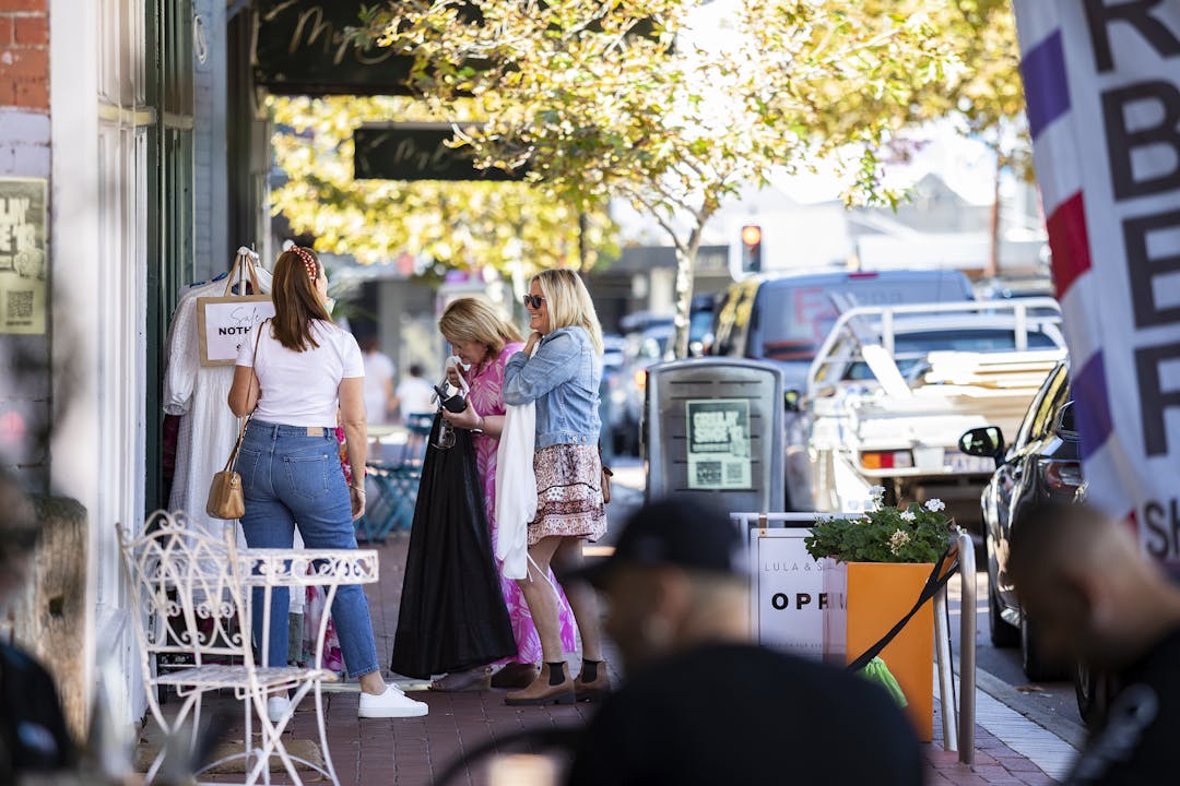 Women enjoying some retail therapy in a busy North Perth street.