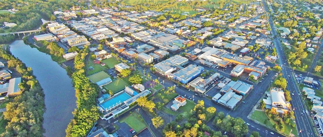 Aerial colour photo of the city of Lismore including the river and CBD. 