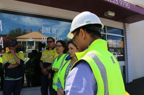 Lord Mayor, Alderman Burnet and Cheng with the works crew