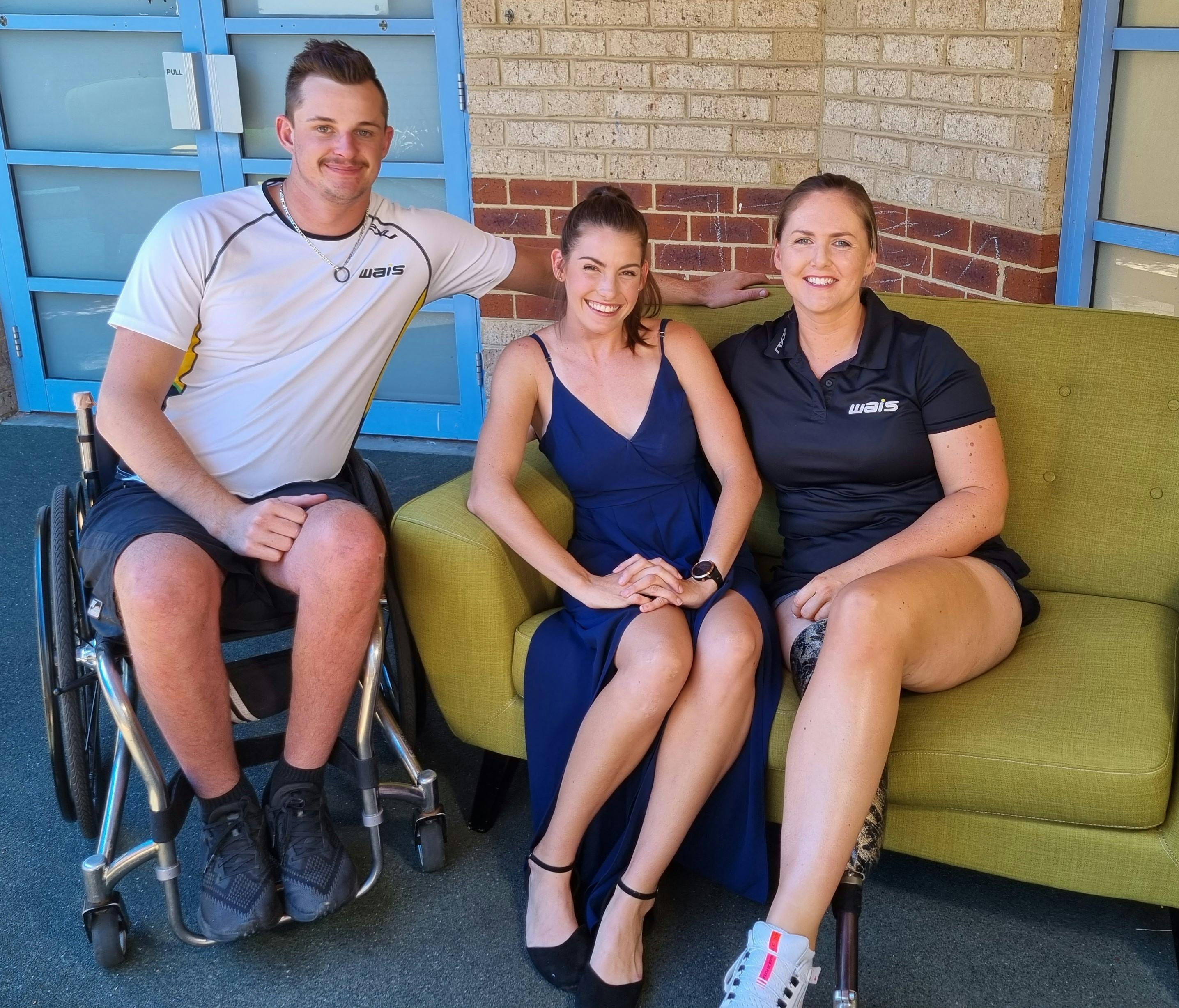 Young people with disability seated on a sofa and in a wheelchair.