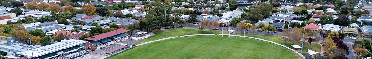 aerial view of Unley Oval and surrounding streets, Adelaide CBD on the horizon