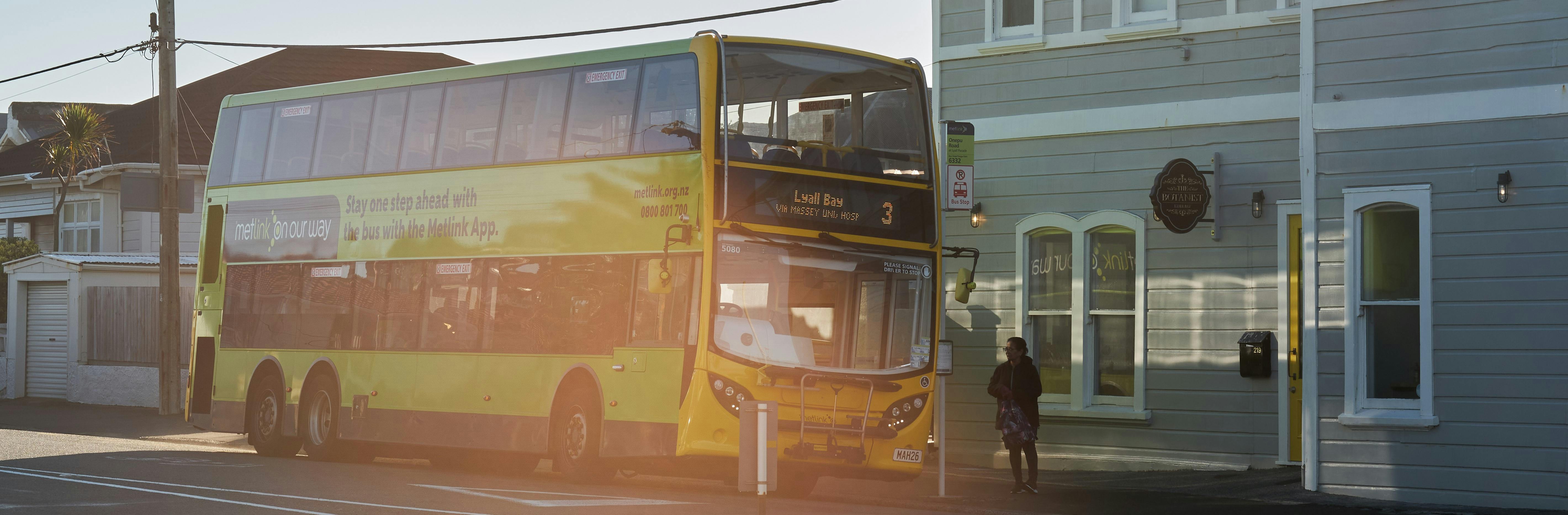 Photo of number 3 Lyall Bay bus waiting at a stop with a passenger waiting to get on