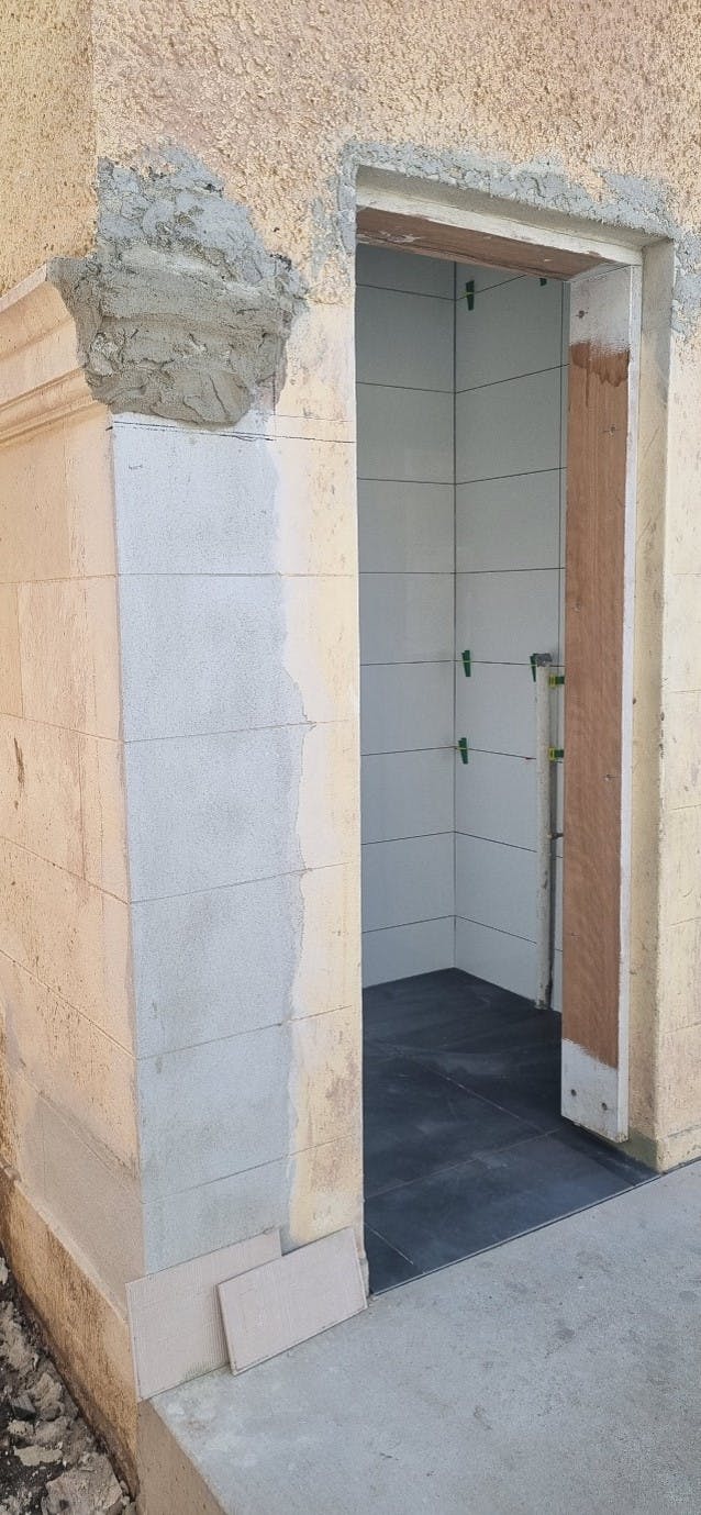 Cement render repairs progress - Barolin St Toilet Block.jpg