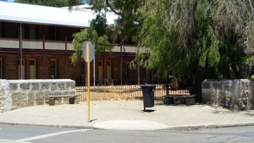 The image captures an area with the appearance of being part of the property at 45 Henderson Street, rather than road reserve.  This forms the portion noted as located behind the heritage limestone wall for proposed closure and amalgamation.  Currently this land is encroached upon by 45 Henderson Street (former Courthouse and Police Station).