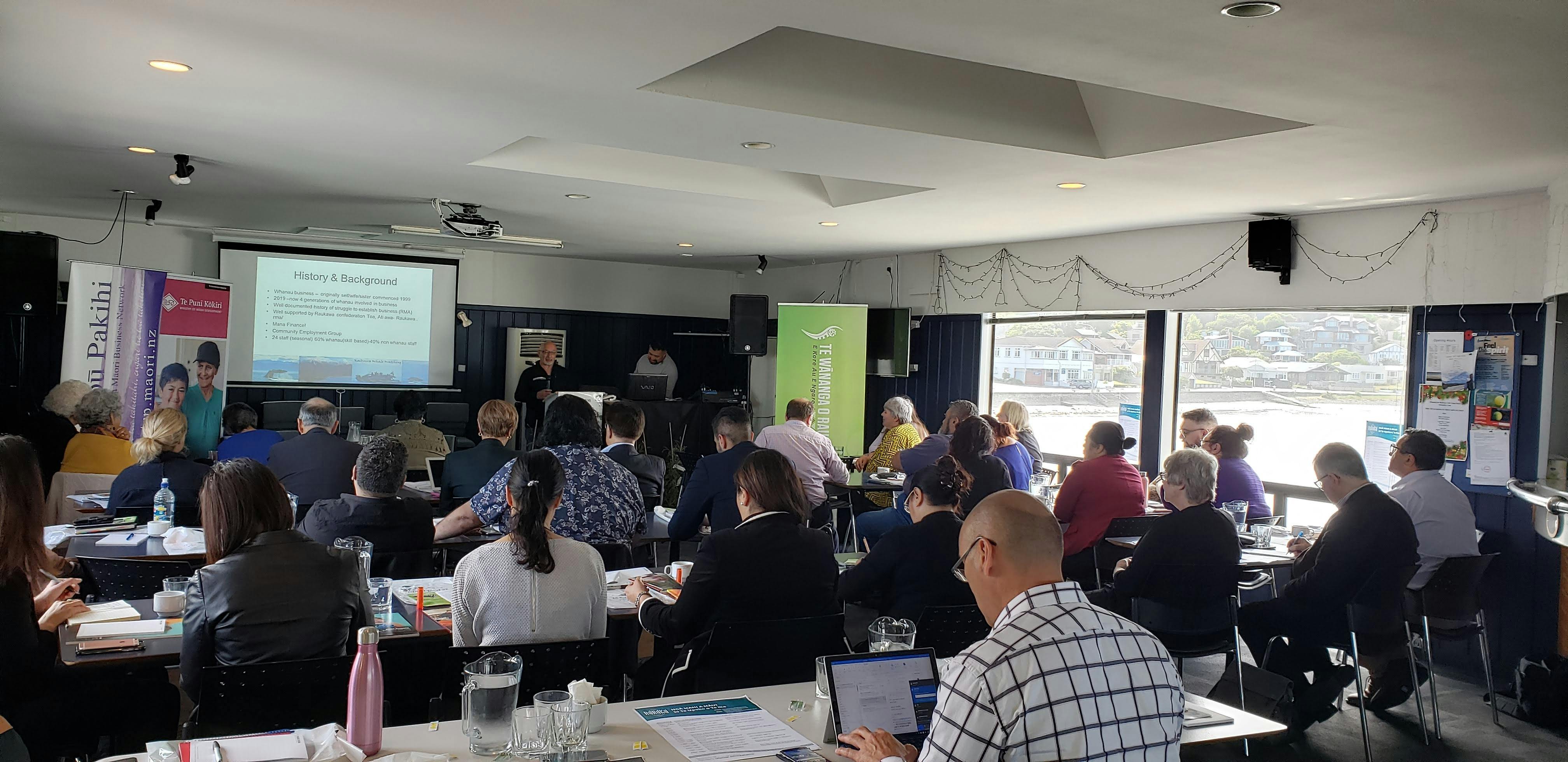 John Barrett presenting at Ngā Mahi A Māui