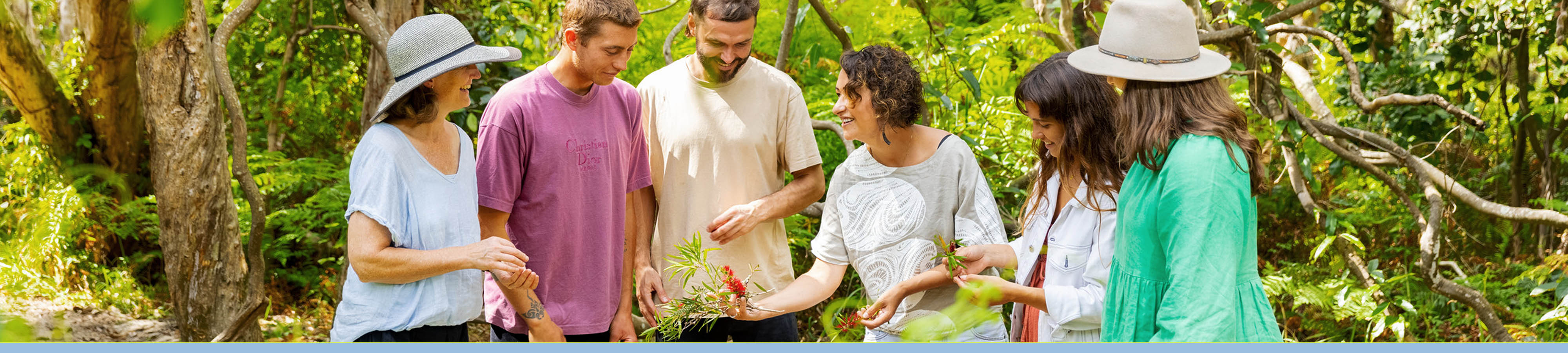 People connecting with flora through Indigenous interpretation. Image by Tourism and events Queensland.