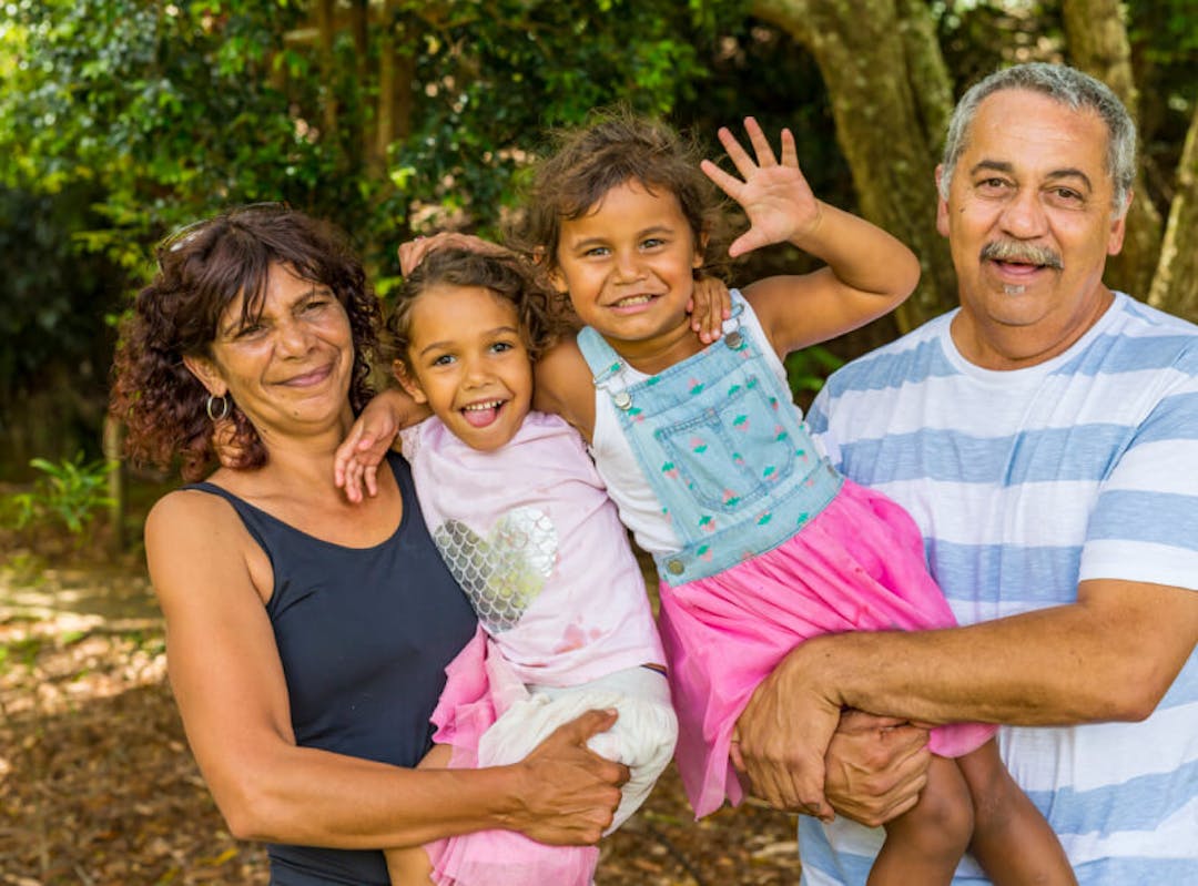 Aboriginal family, mother, father and two young girls.