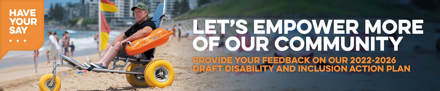 Banner with Lets Empower More of Our Community and image of a Beach Wheelchair