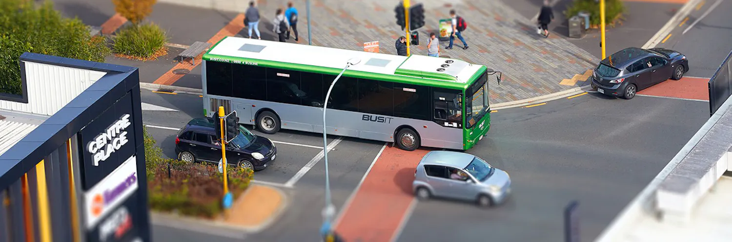 Image of a bus on the road turning the corner