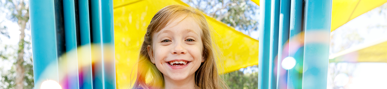 Smiling girl in a playground