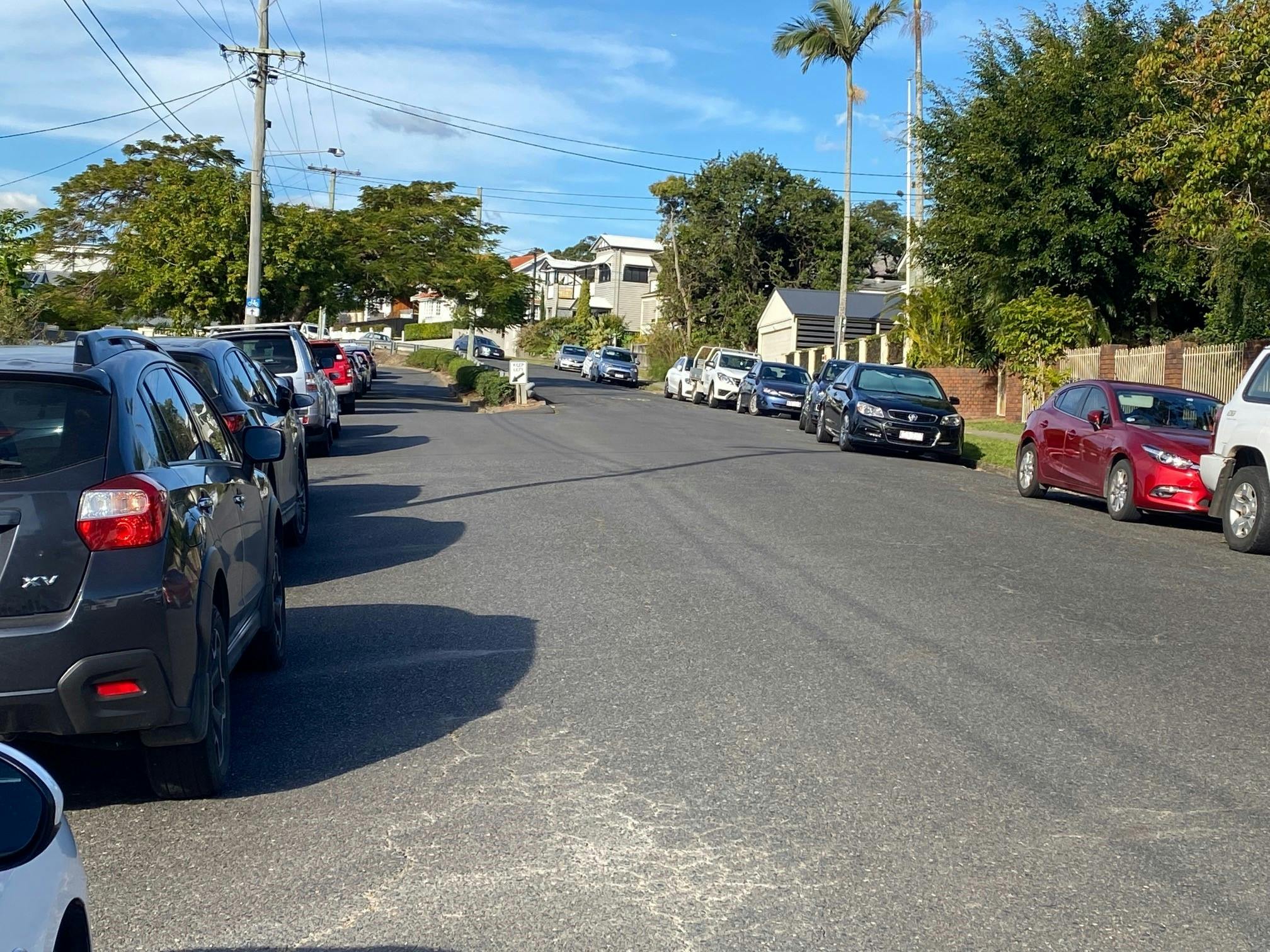 Another photo of cars parked along both sides of Nicholson Street, Greenslopes
