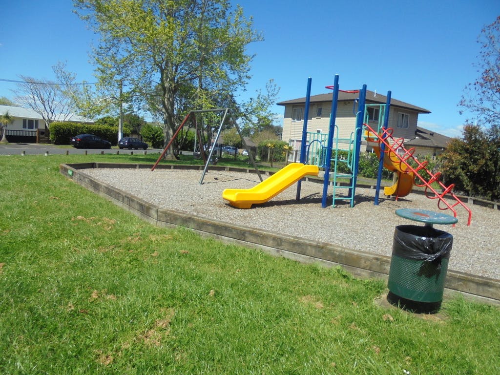 The existing playground contains a basic module with two slides, and swings at Kāmaka Park.