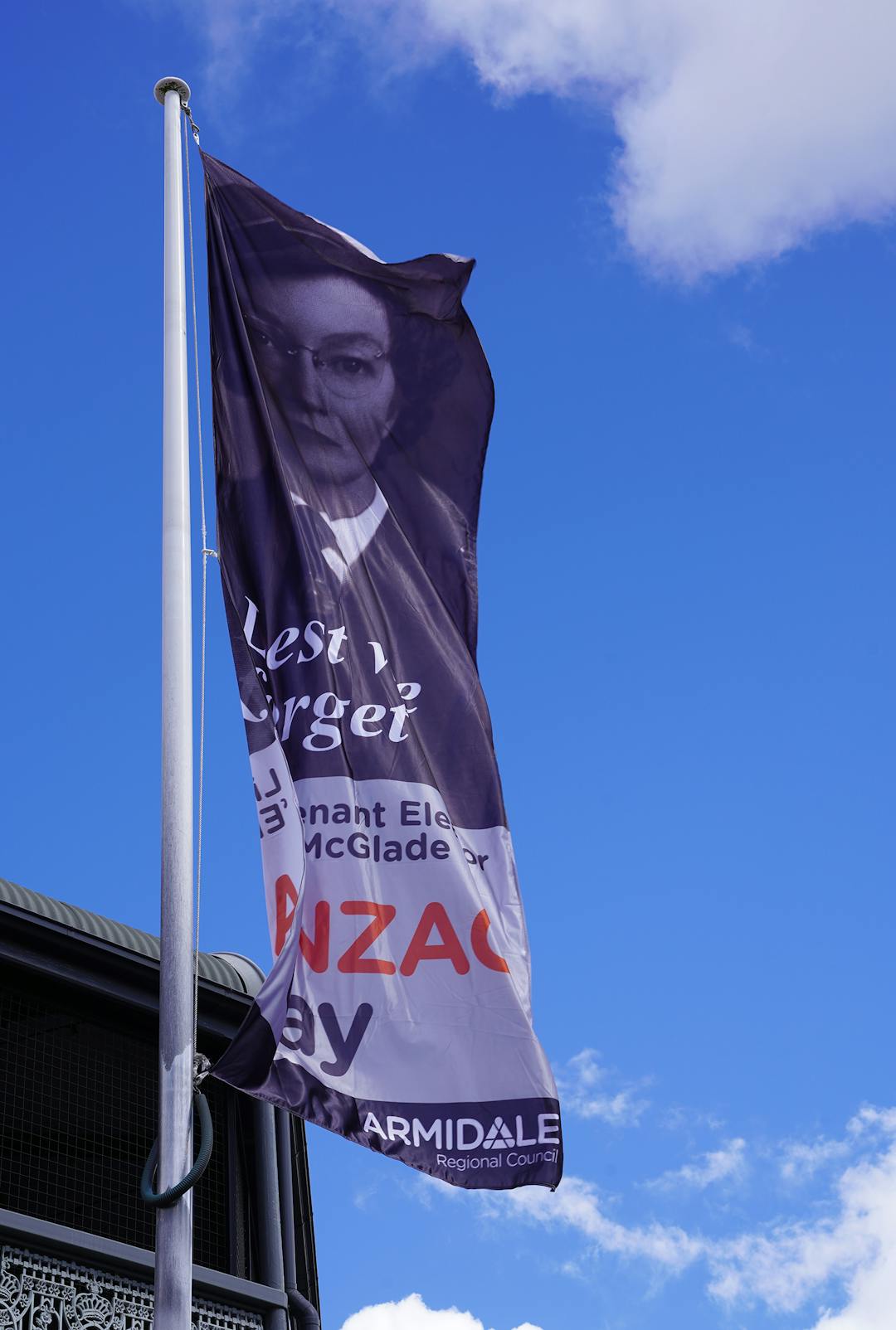 Anzac Day flag hanging on flag pole in Beardy Street Mall