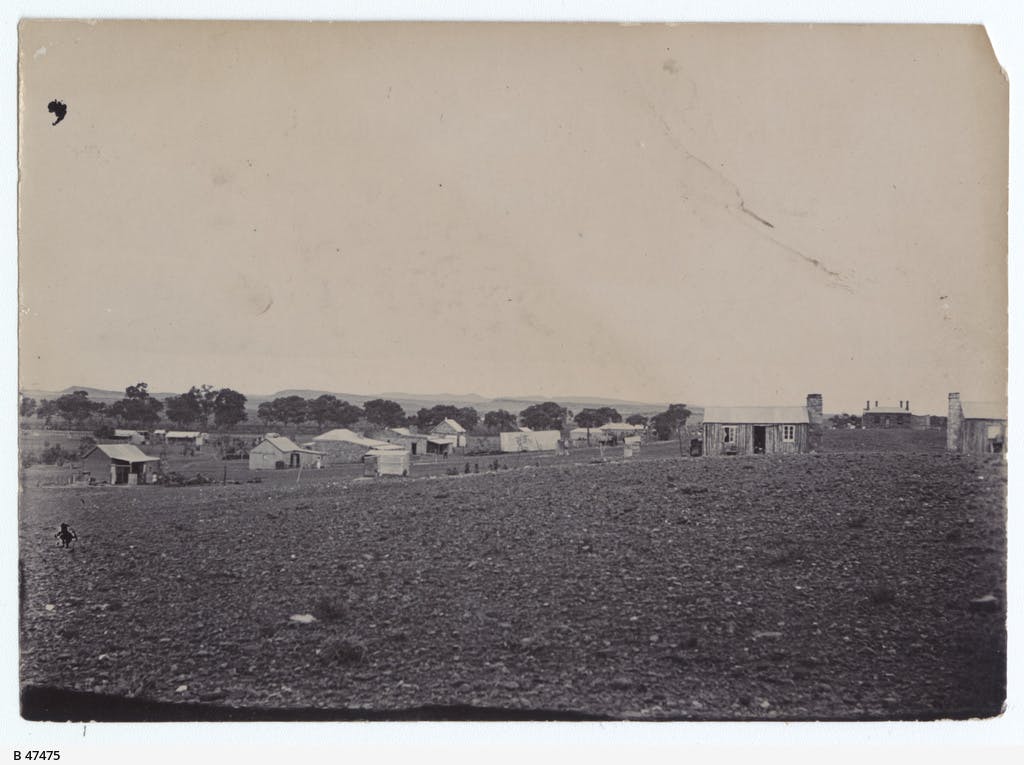 Black and white photograph of Beltana township in 1897, a small cluster of small, plain buildings