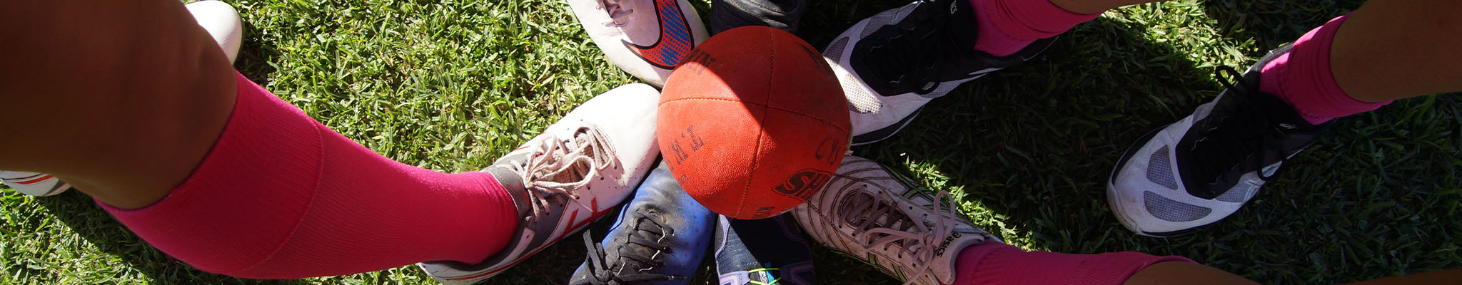 Image of football boots and a football