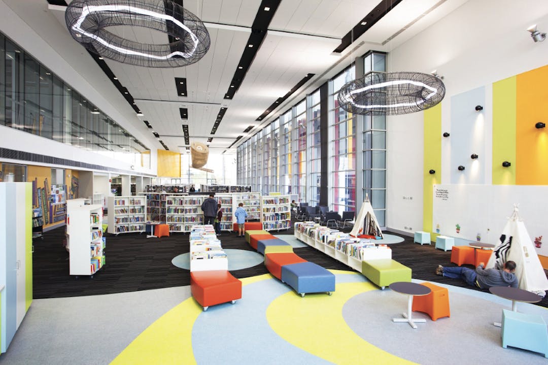 Bookshelves and children's area of the library