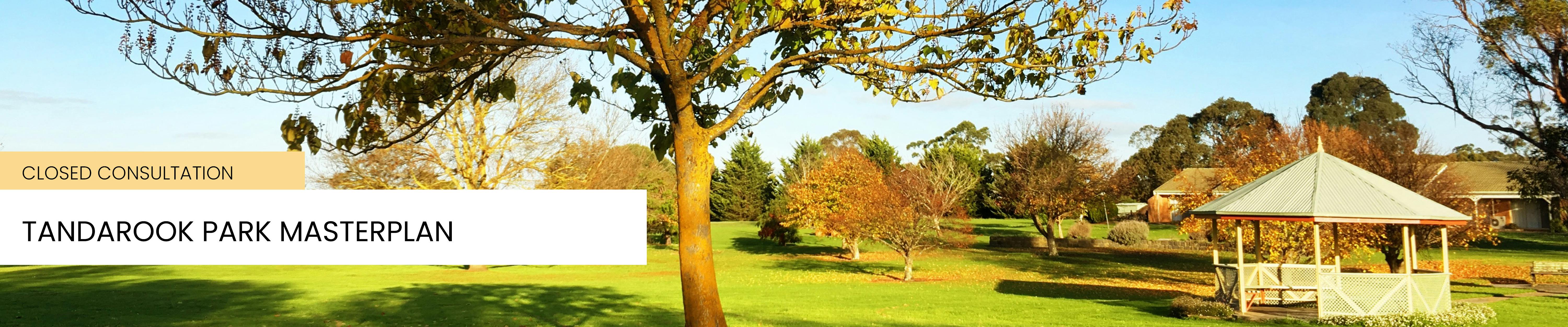 An image of trees and rotunda in Tandarook Park, Cobden. The leaves are autumn colours in afternoon light.