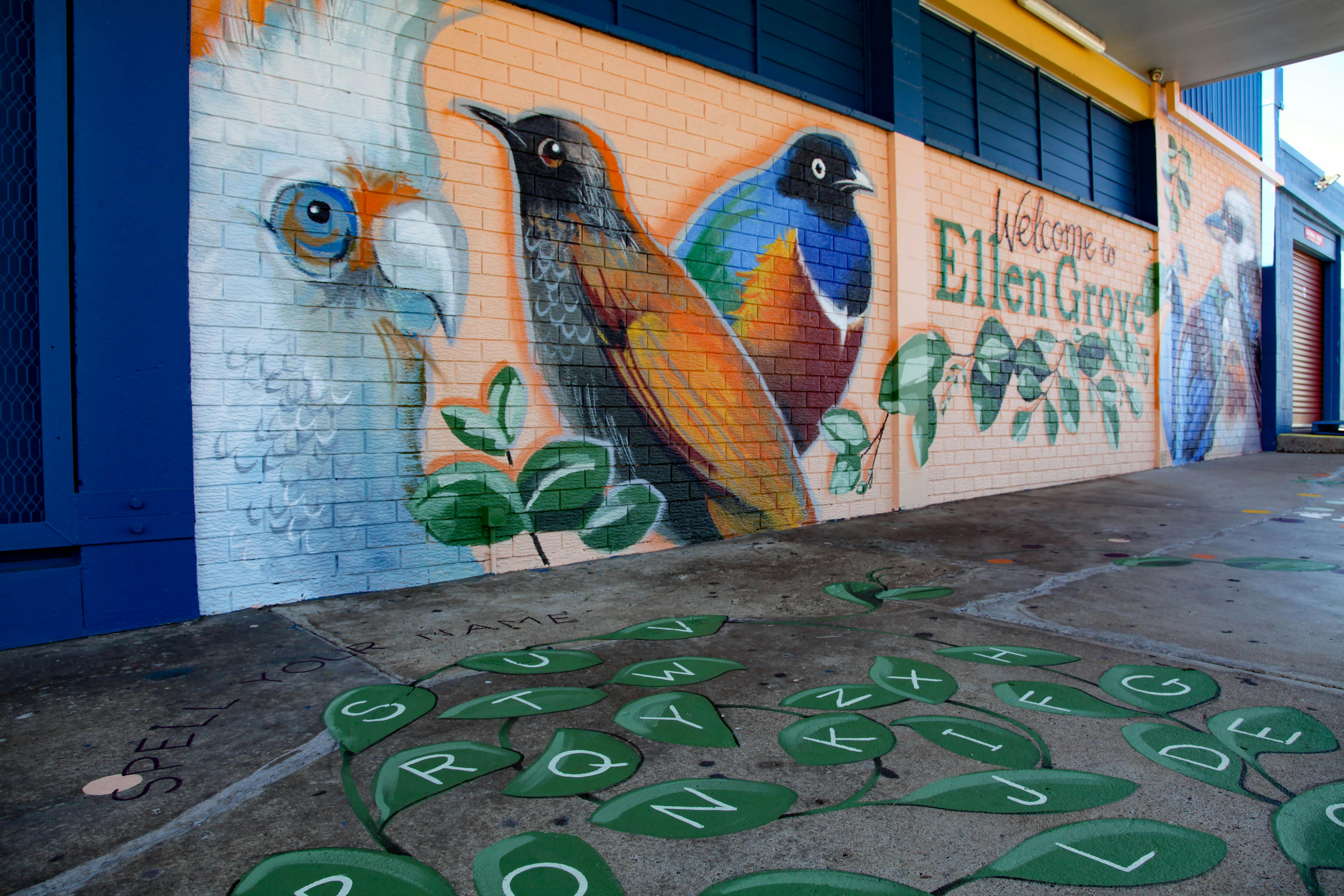 Photo of the 'Welcome to Ellen Grove' mural and ground games