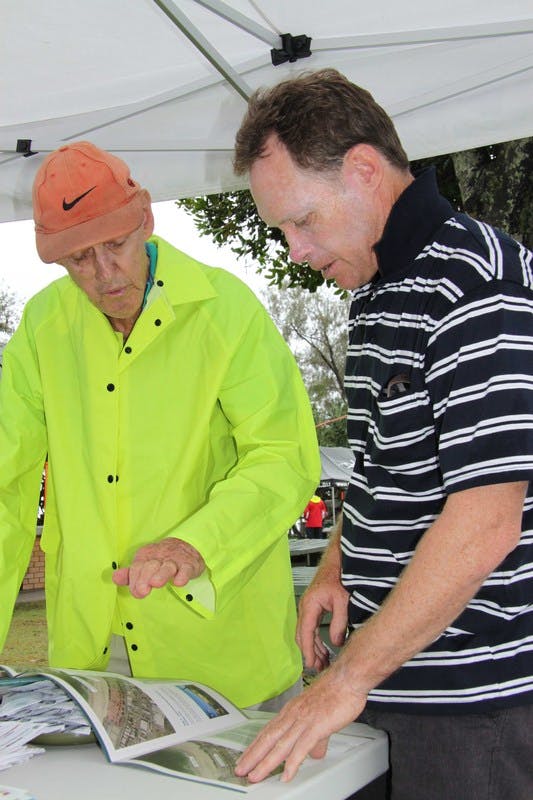 Noel Manthey (left), a Kingscliff resident for more than 30 years, discusses the Central Park concept plans with Council's Senior Design Engineer, Warren Boyd, at the community information stall in Kingscliff.