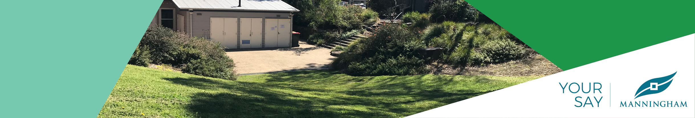 Two people jumping off rocks in a small bush garden