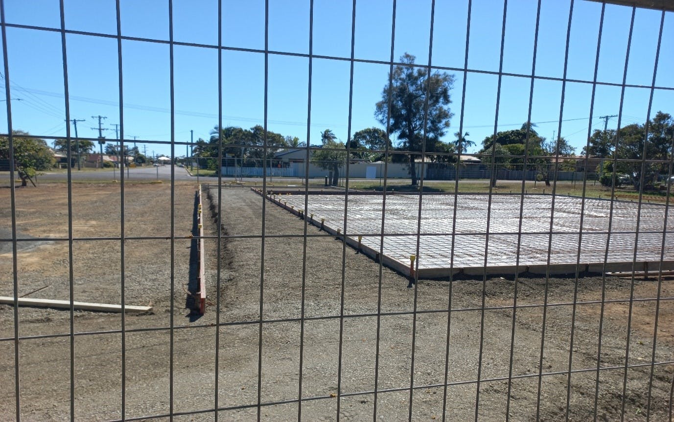 Laurisen Park - basketball court slab boxed up and forming up pathways July 2024.jpg