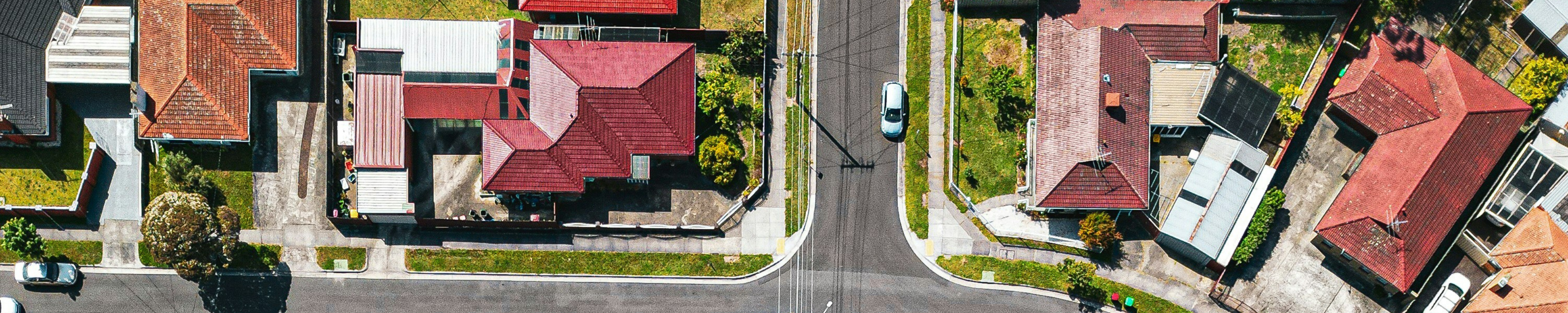 Drone view from neighbourhood showing a group of houses and streets