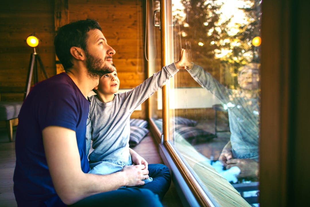 two people sitting on a lounge and talking