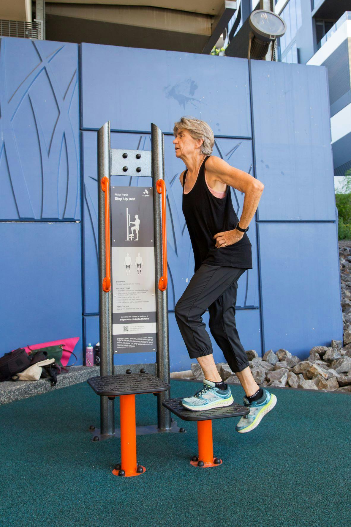 Image of a person using outdoor gym equipment