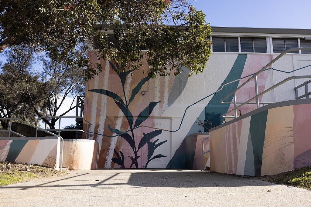 View of the finished Moresby Street Hall mural from the driveway on Douglas Avenue