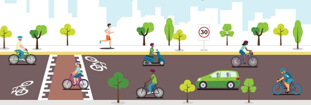 Cyclists riding down a bike boulevard.