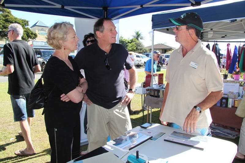 The Mayor of Tweed, Councillor Kevin Skinner, talks to visitors to the community information stall at the Pottsville Markets. 