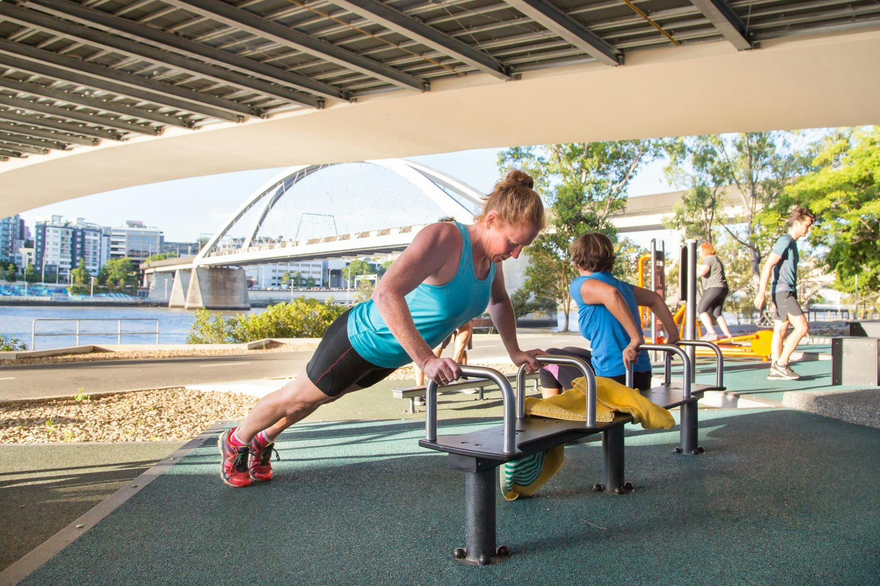 Image of a person using outdoor gym equipment