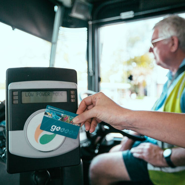 Person using a go card on a bus