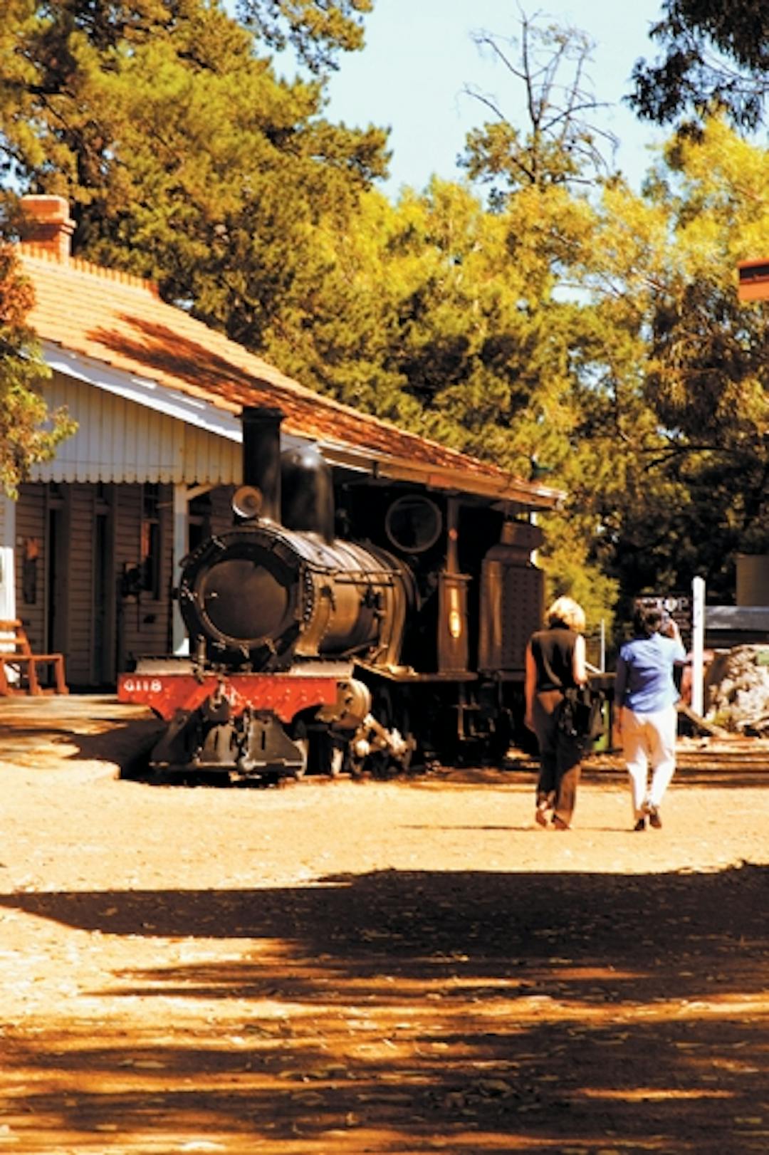 Kalamunda's Historic Village with steam train, gum trees and weatherboard buildings