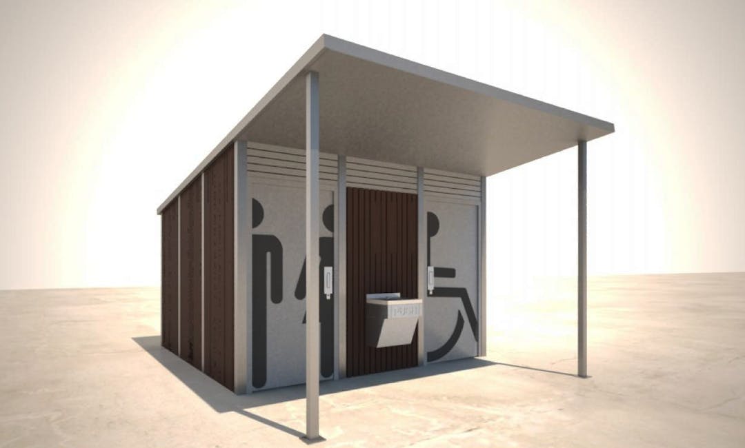 Modern accessible public toilet block. Brown and white with the standard wheelchair image.