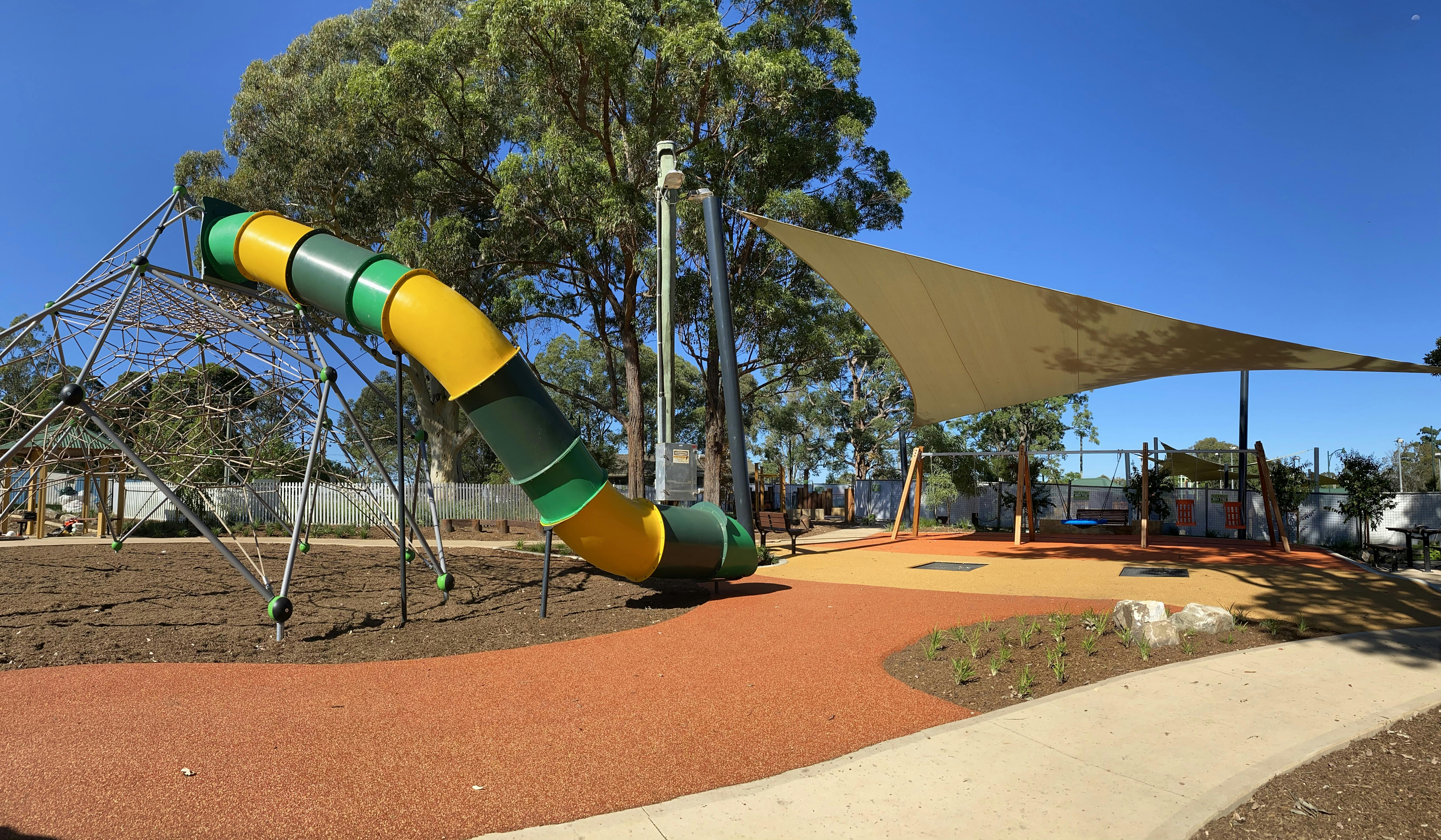 Climbing Tower and Slide with the Swings and Trampoline to the right