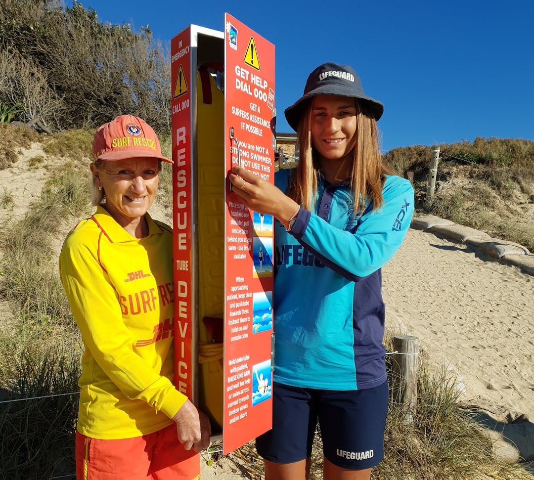 Sawtell Surf Life Saving Club president and Council lifeguard display the remote rescue tube device to be trialled in the Sawtell area over the 2019/20 Summer period 