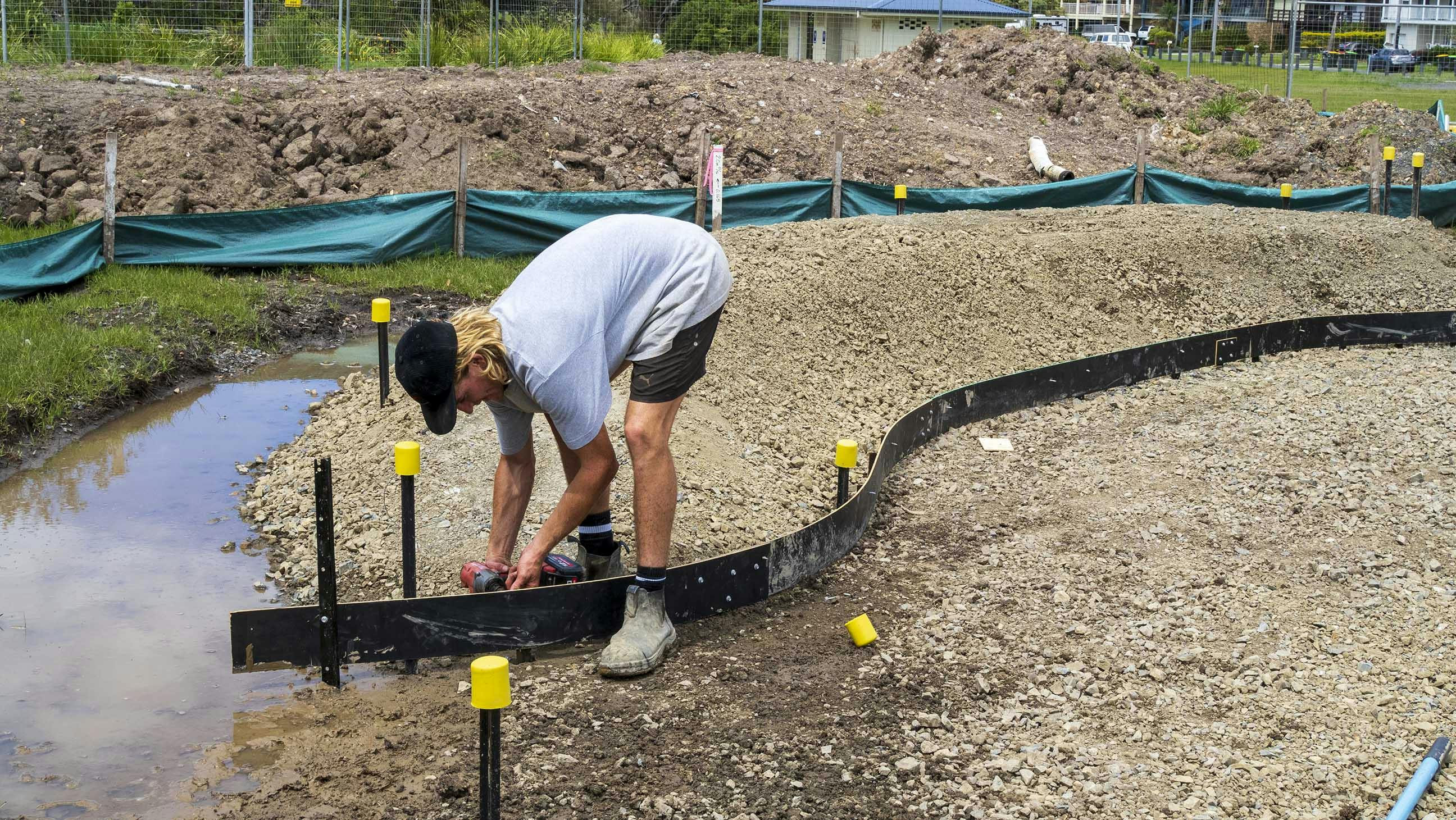 Tradesman at work on the new skate park in the Active Youth Space, Sandy Beach Reserve.