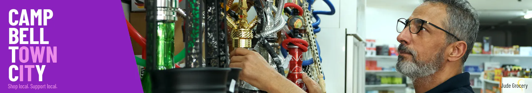 Man fixing up items in shop