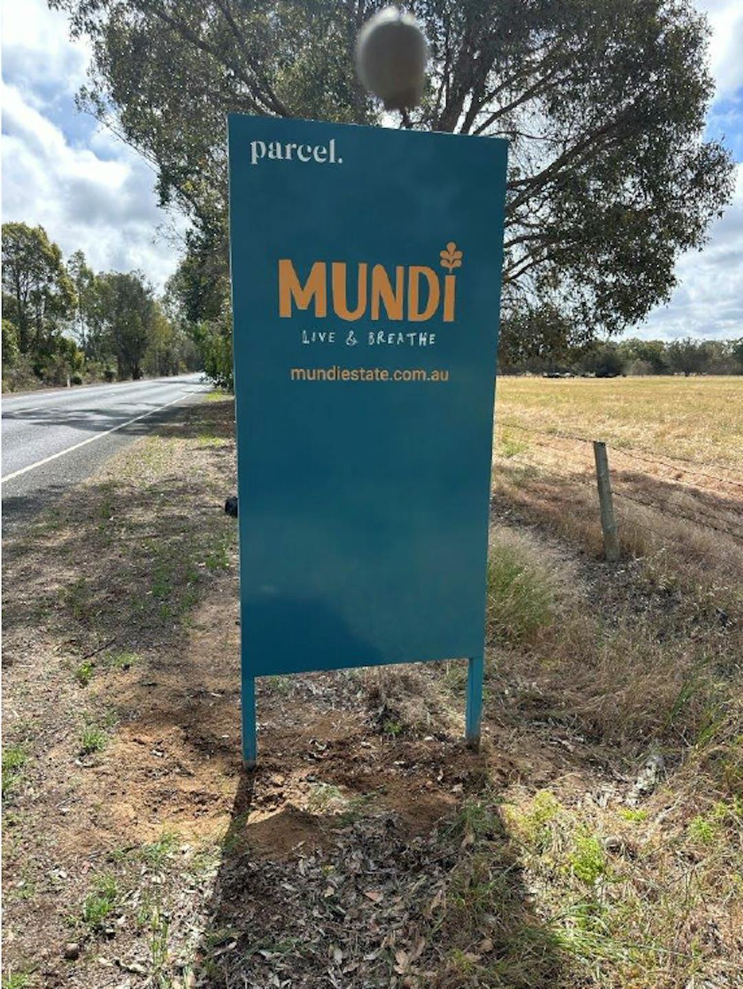 Land estate signage on side of road