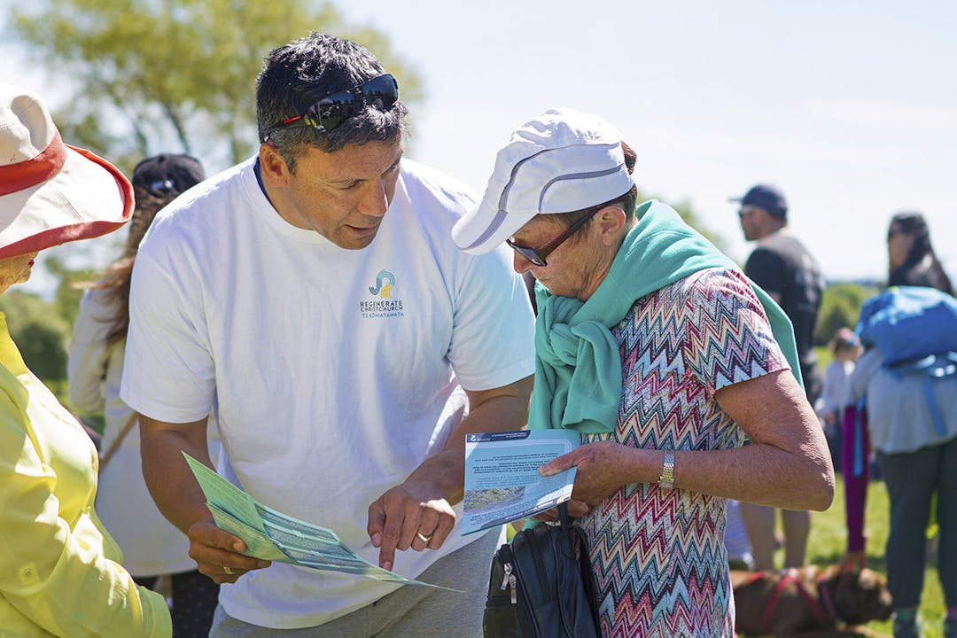 A Regenerate Christchurch representative in discussion with a member of the public at an engagement event. This image shows a Regenerate Christchurch representative in discussion with a member of the public at an engagement event.