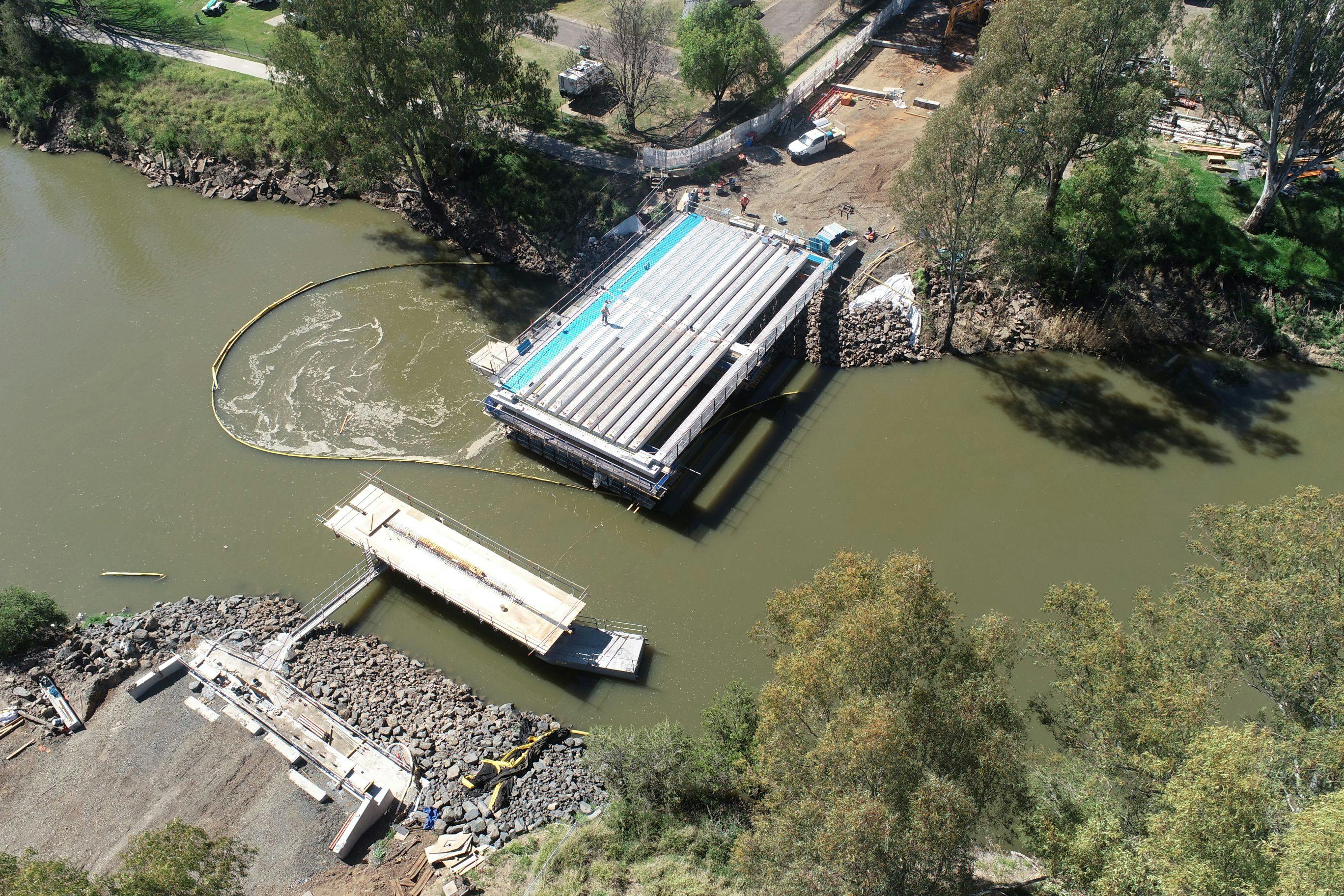 Beams have been lifted and placed in preparation for the construction of the bridge deck for the first two spans of the new Violet Street Bridge.