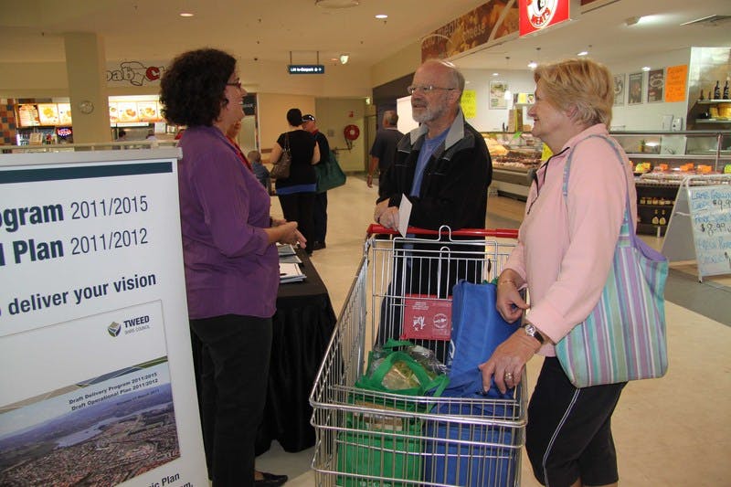 Council's Communications Officer - Media, Fran Silk (left), discusses the Delivery Program and Operational Plan with Bob and Noelene Harris of Tomewin during the information stall at Murwillumbah's Sunnyside Shopping Centre.