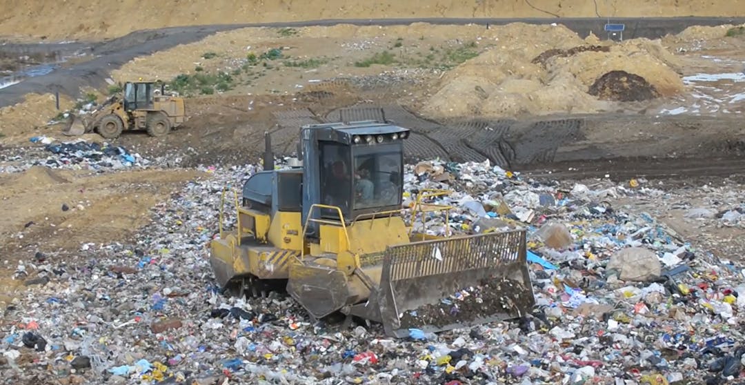 Bulldozer moving rubbish at Caroline Landfill