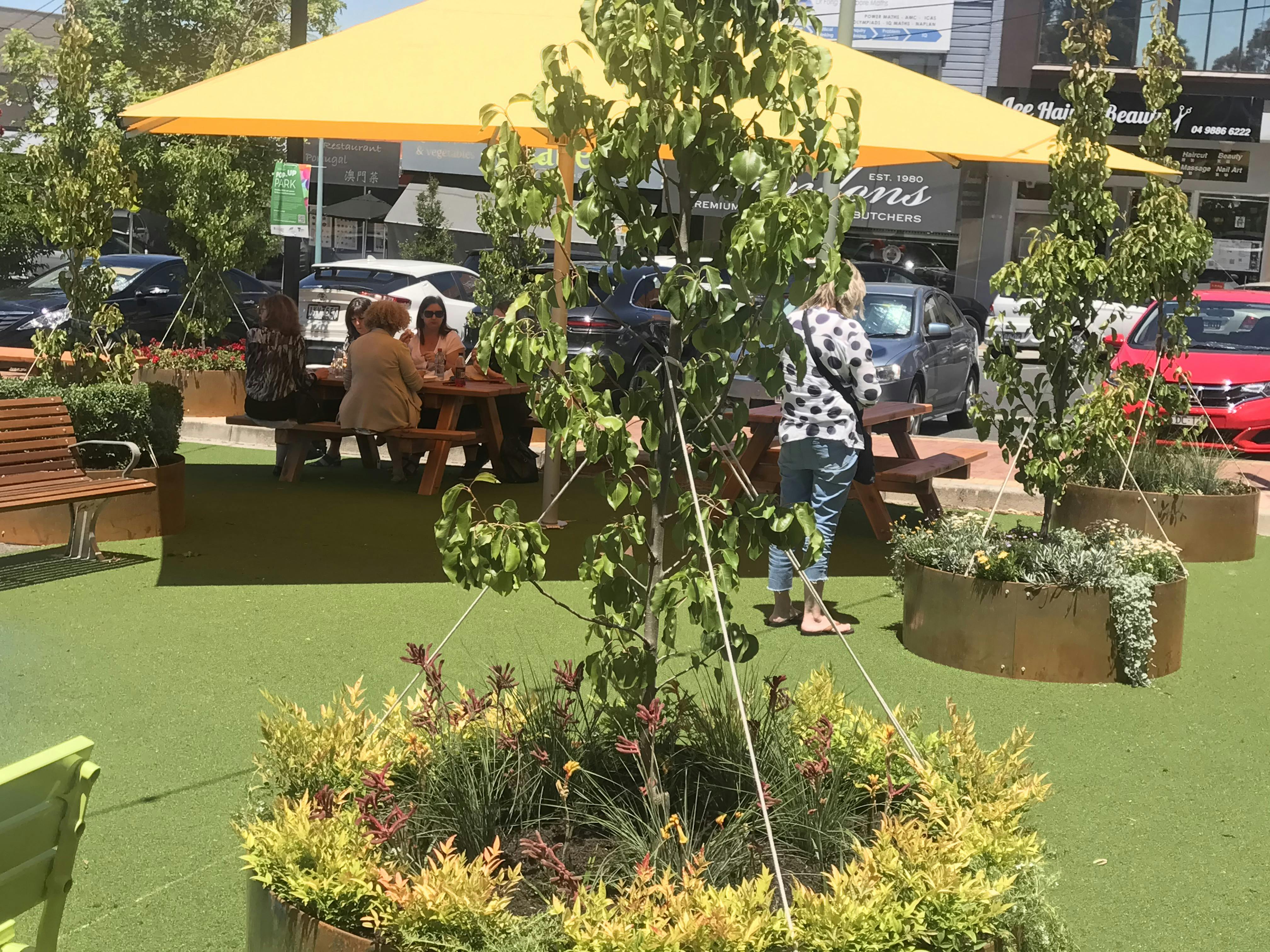 Lunch outside in a new temporary park in Jackson Court