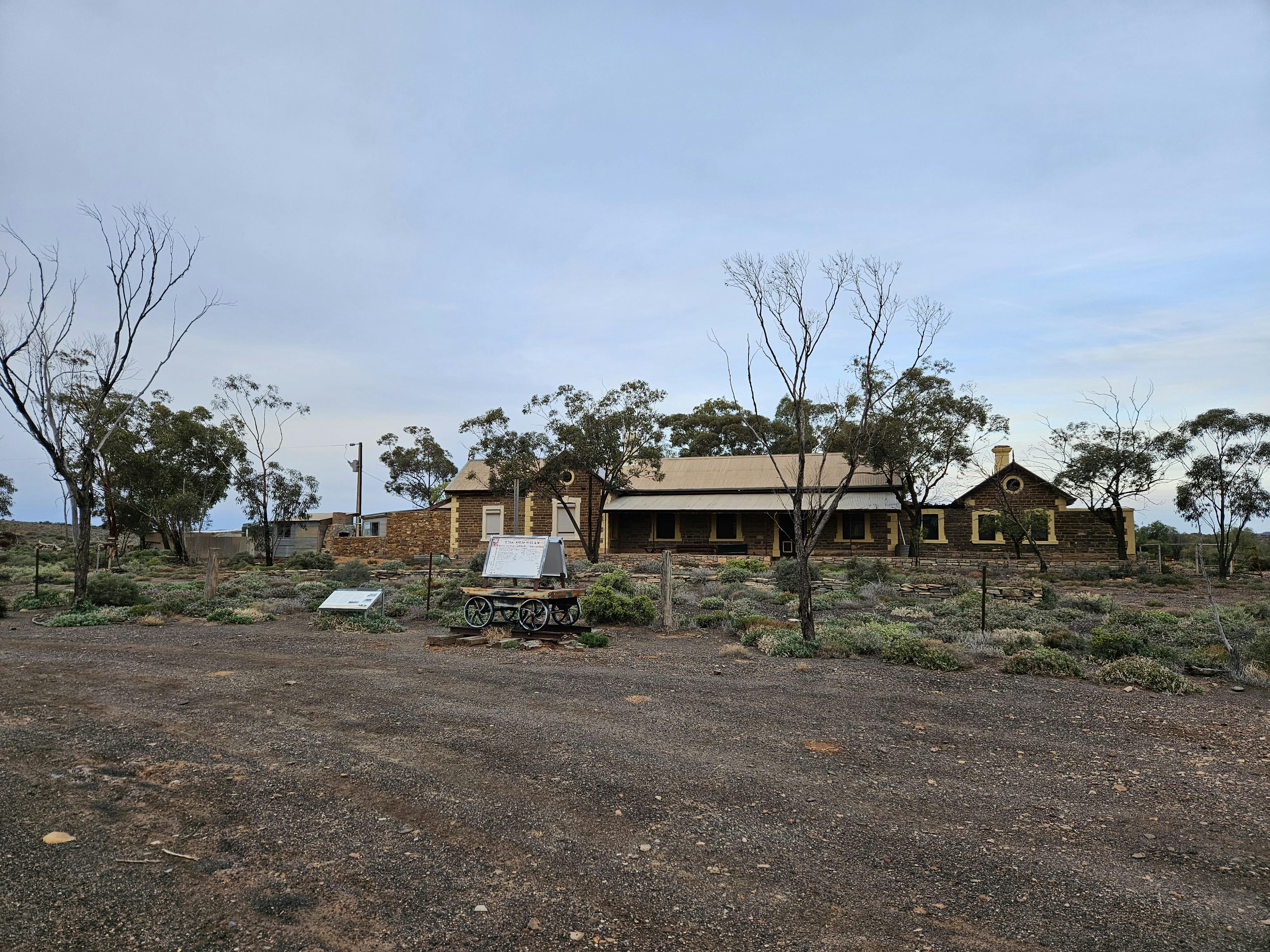 The railway station, which ceased operation in 1956, is a substantial single storey stone building.
