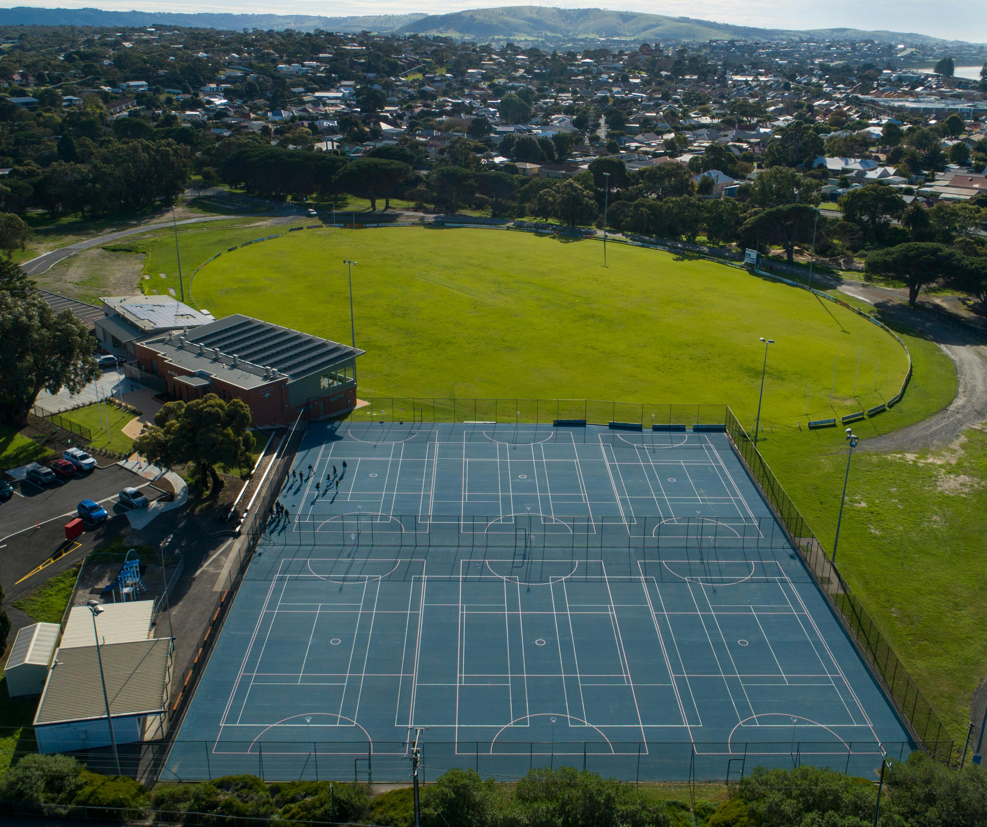Sporting grounds with outdoor courts and oval