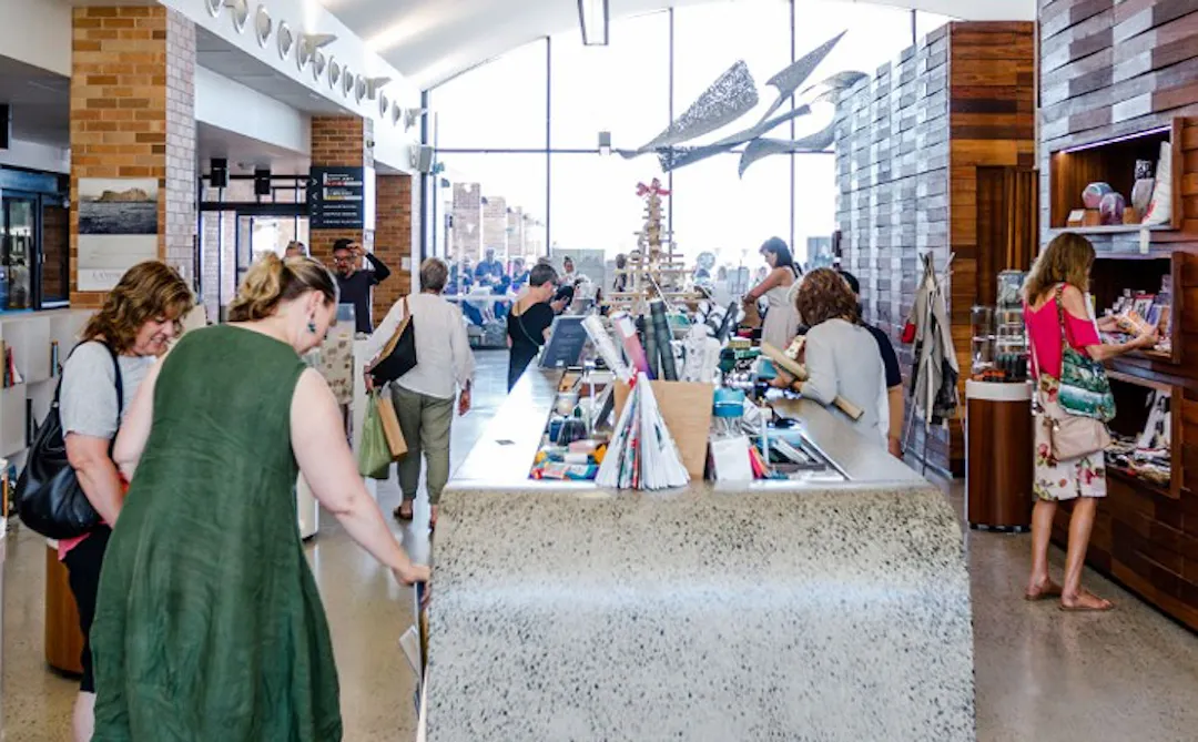 several shoppers crowded in a busy store int eh Cultural Centre 