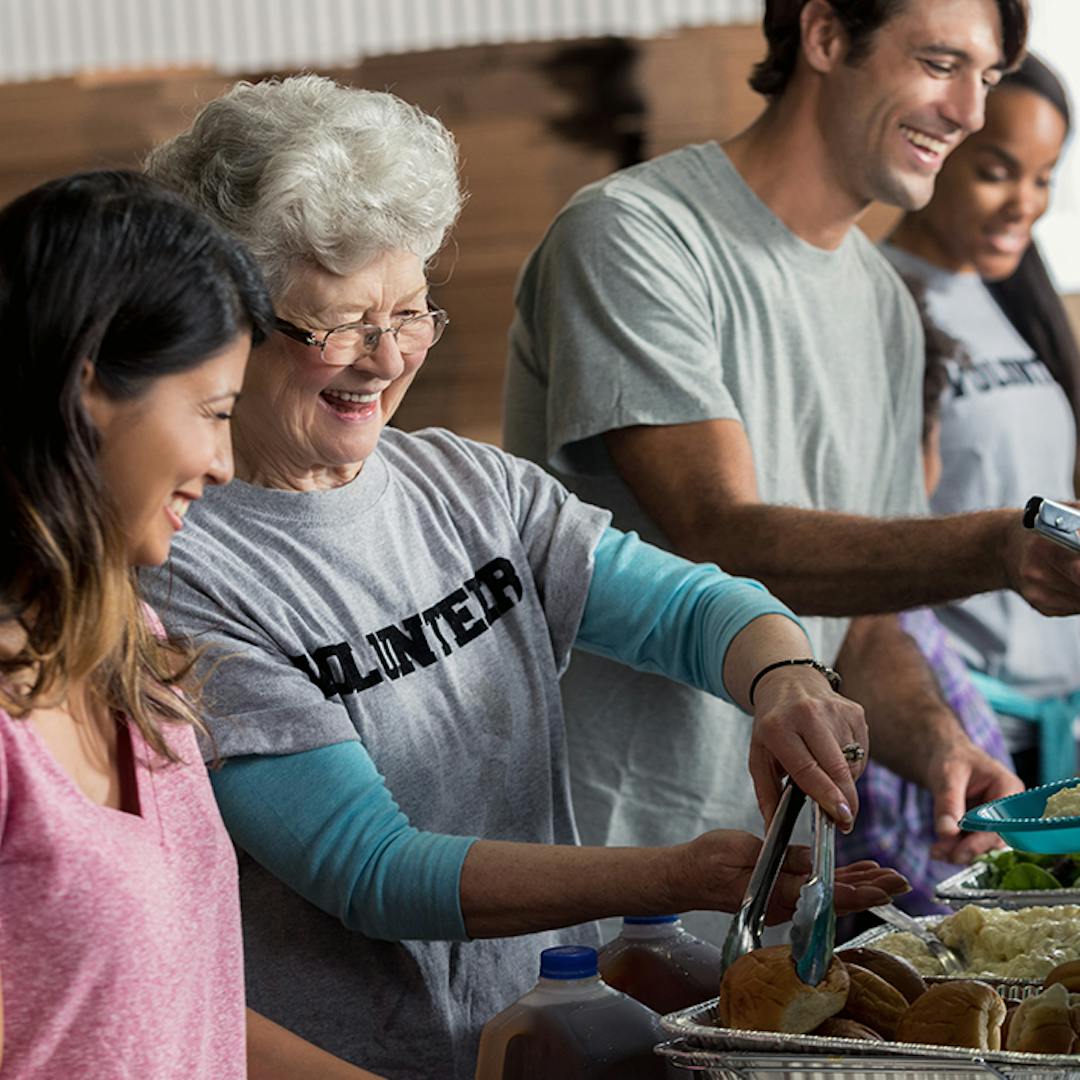 Community volunteers serving food